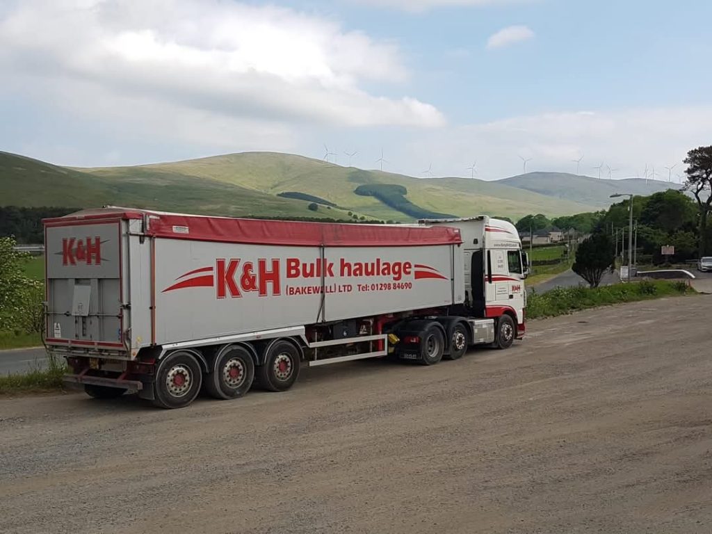 white K&H (Bakewell) Limited DAF truck pulling bulk haulage tipper truck