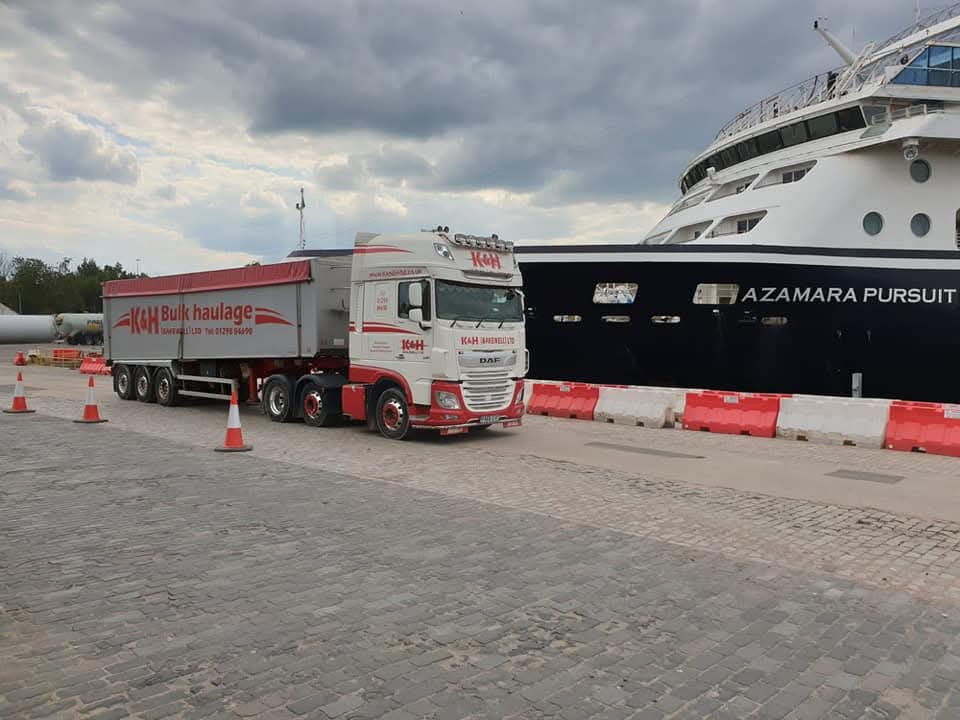 white K&H (Bakewell) Limited DAF truck pulling bulk haulage tipper truck